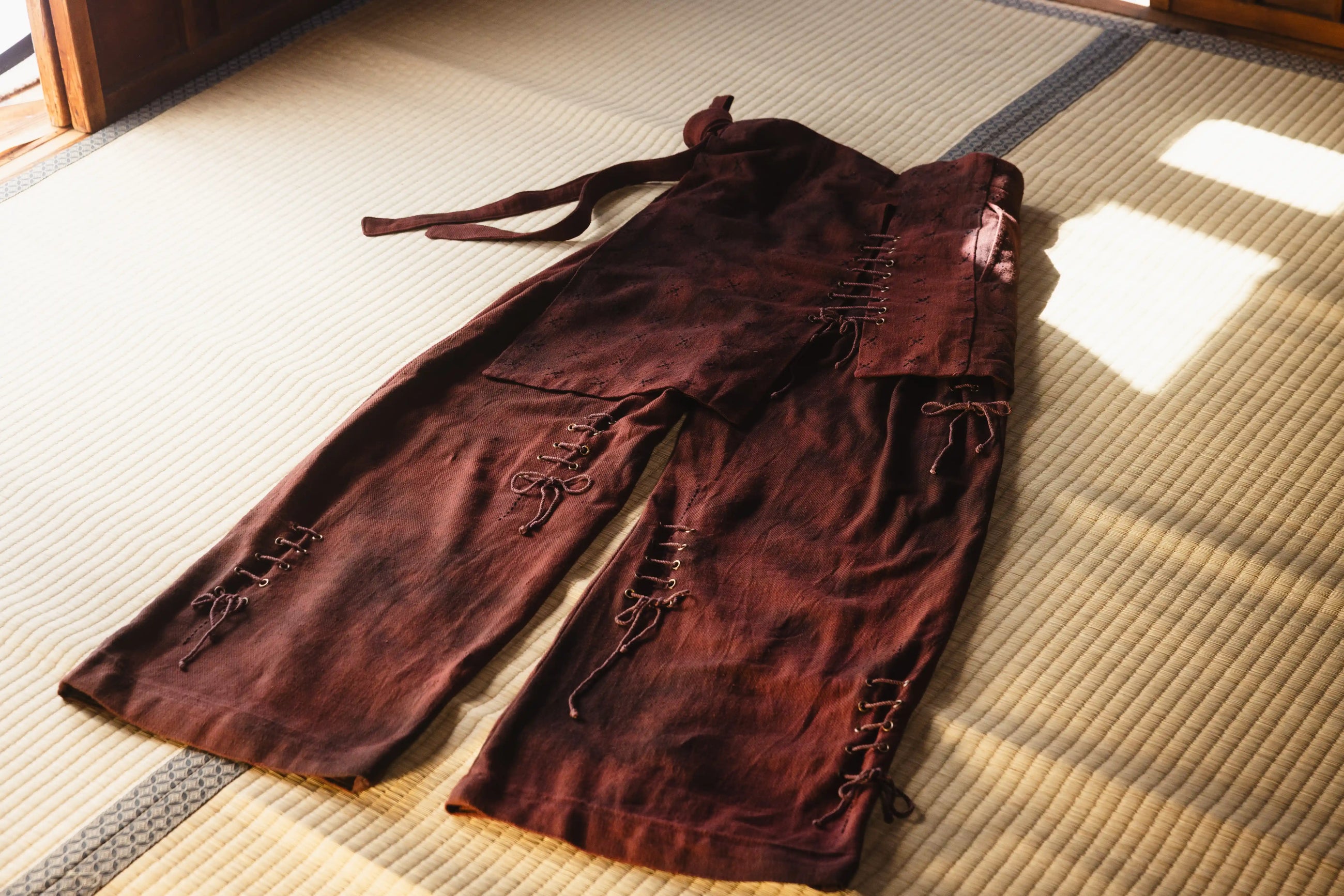 Brown pants on a tatami mat