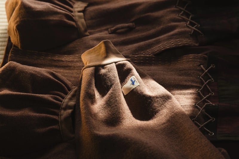 Brown fabric with a logo on a wooden surface