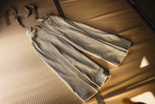 Light-colored skirt on a textured surface