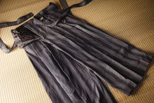 Dark gray apron on a textured surface