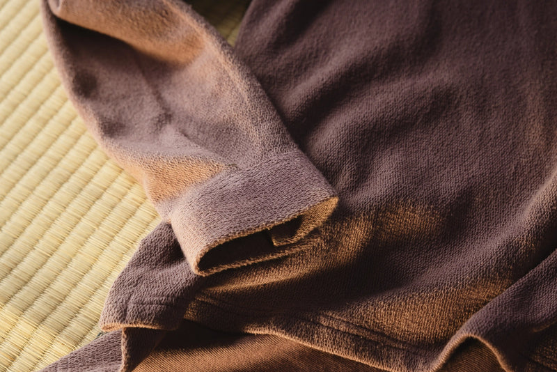 Brown towel on a textured surface
