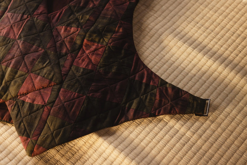 Quilted fabric with geometric pattern on a textured surface