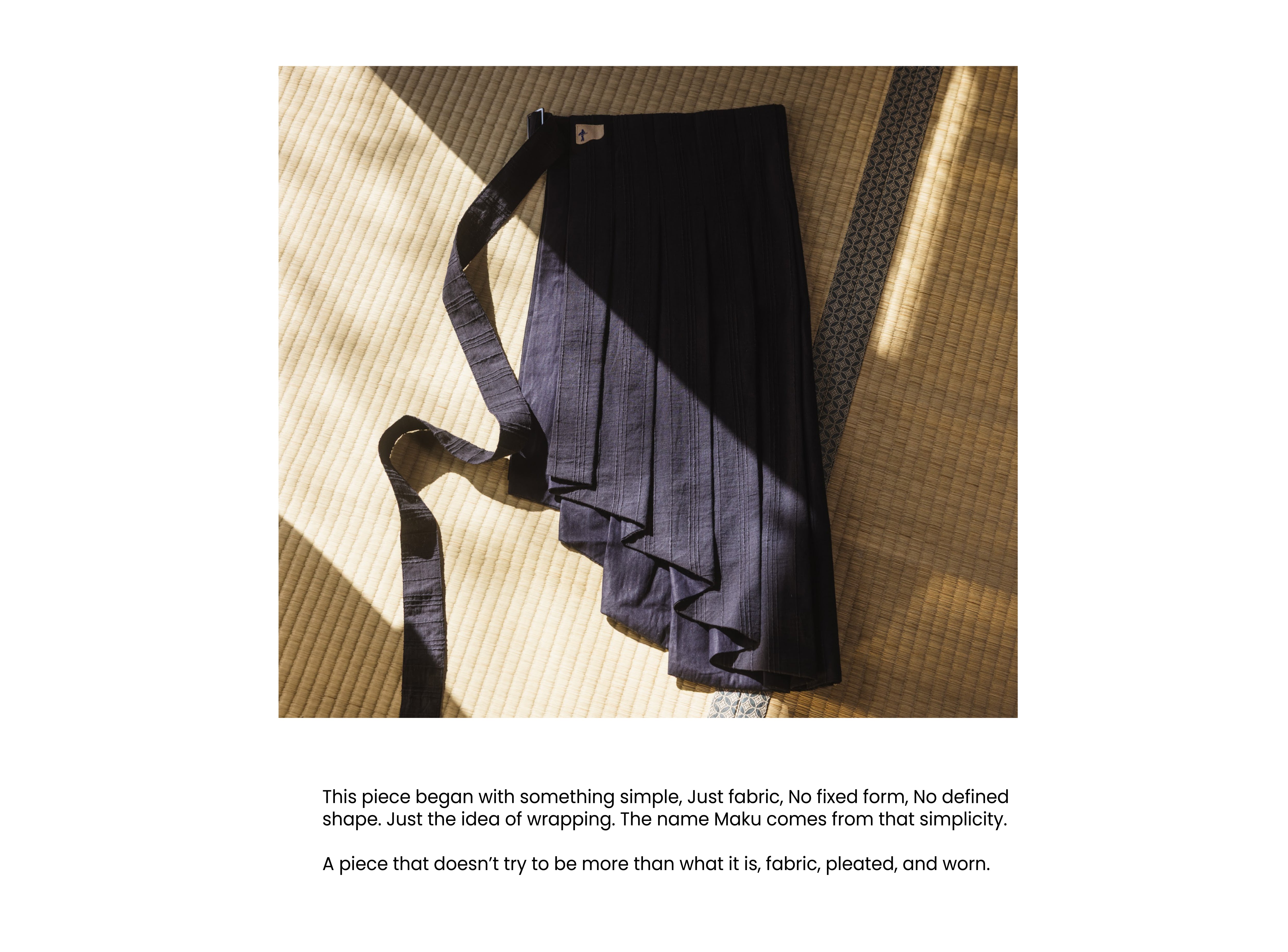 This is a SLOOP slow fashion pleated Maku belt or wrap skirt featuring an asymmetrical design.